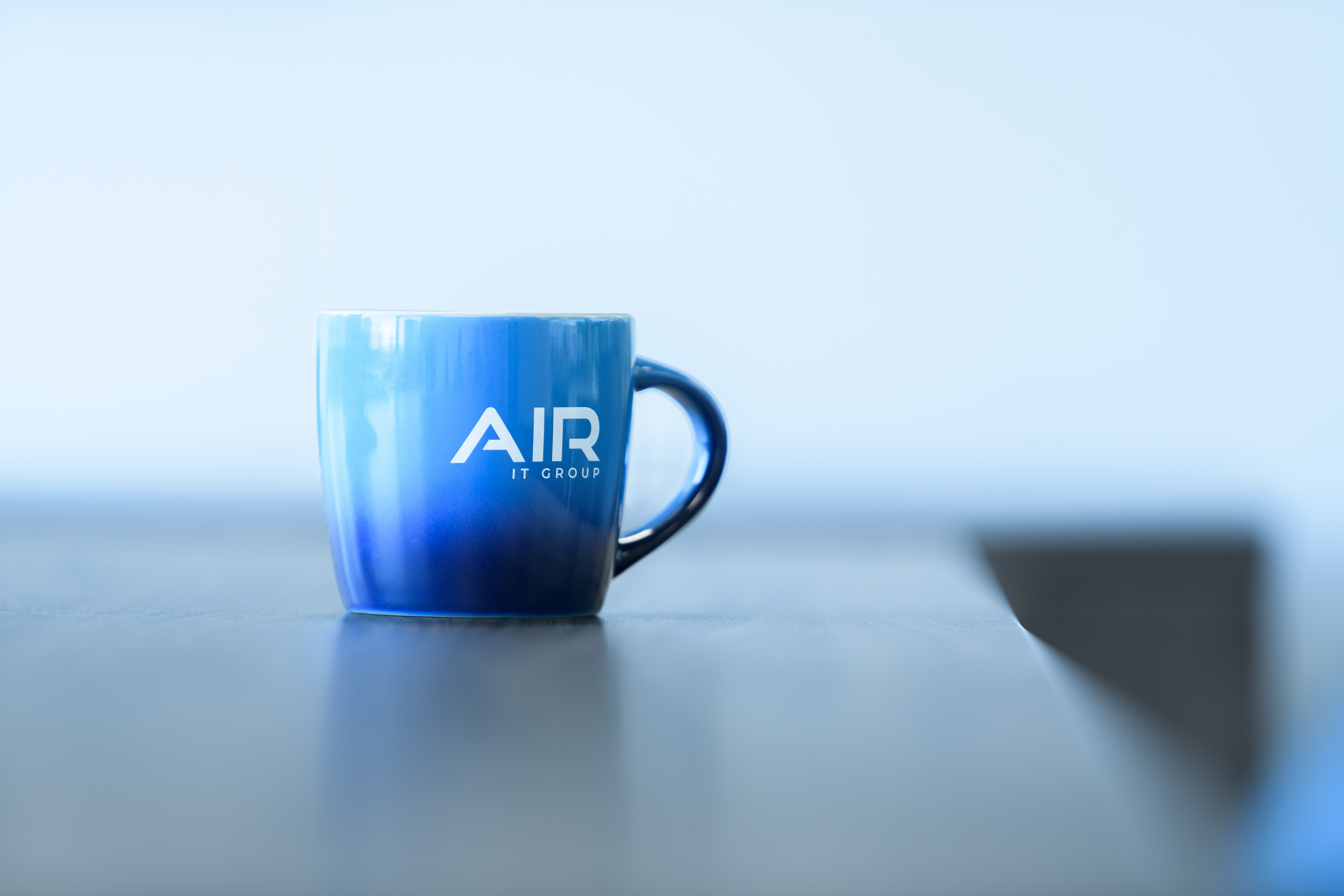 Air IT mug on a desk
